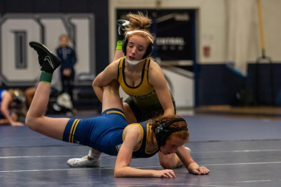 Junior Faith Cole takes down her opponent at the Wenztville Holt Quad earlier in the season. Cole helped lead the team to a second place plaque at the Kansas City Duals on Jan. 15.