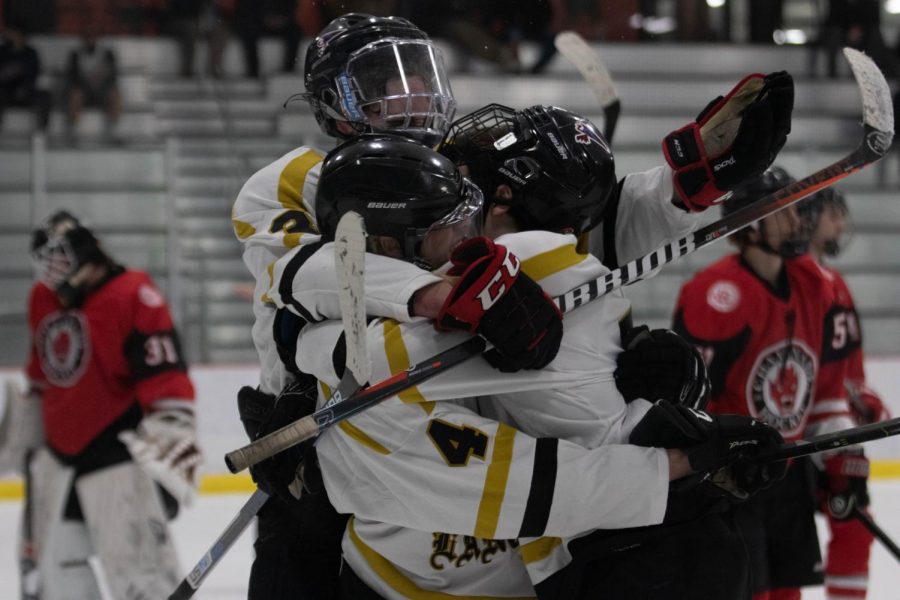 Members of the Lancer hockey team celebrate after a goal against their opponents, Chaminade, in the third game of the Challenge Cup Round Robin playoffs. The Lancers won the game, 3-2.