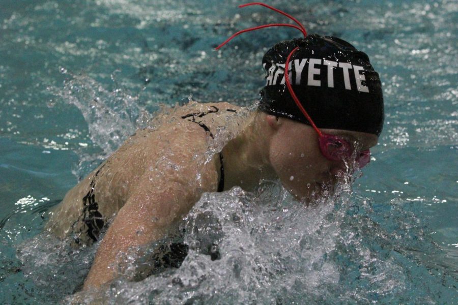 Sophomore Grace Tyson swims in a meet against Webster Groves at Lafayette. The Lady Lancers placed third overall in the Suburban Yellow Pool Conference on Feb. 3.