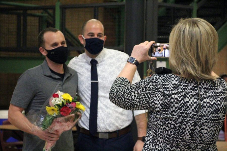 Teacher of the Year Mark McAllister and his nominator, Business Department Chair Scott Beaver get their photo taken by Principal Karen Calcaterra after McAllister was surprised in the Commons with the announcement that he had been selected for the honor for the 2020-2021 school year. McAllister is the Industrial Technology Department Chair and also coaches field hockey, girls basketball and boys tennis.