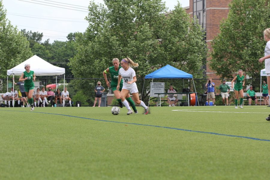 Rising senior Rylee Howard takes the ball down field as a Nerinx Hall player defends from behind during the Class 4 girls soccer Sectional game on May 25 at Nerinx Hall High School. The Lancers fell 0-1 on a corner kick with just over five minutes left in regulation.