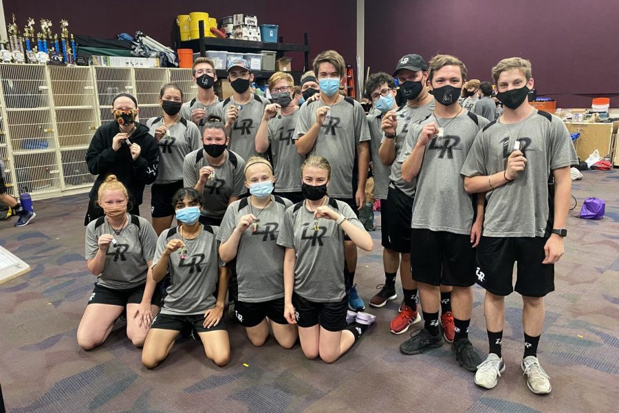 Lancer Regiment members hold up their necklaces. One of them, senior Austin Hammann, was friends with both Thomas Bedell and Matthew McMillen. “I wear my necklace everyday, everywhere I go, even when I’m not at school,” Hammann said. “Personally, it means always remembering my friends, and I really like having the necklace as something to remember them.”