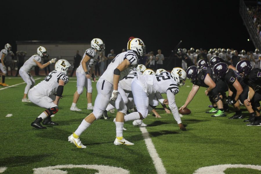 The+D-Line+gets+set+for+the+Eureka+Wildcat+offense+to+snap+the+ball+during+the+Battle+of+109+on+Sept.+17+at+Eureka.+The+Lancers+scored+two+touchdowns%2C+but+lost+35-14.