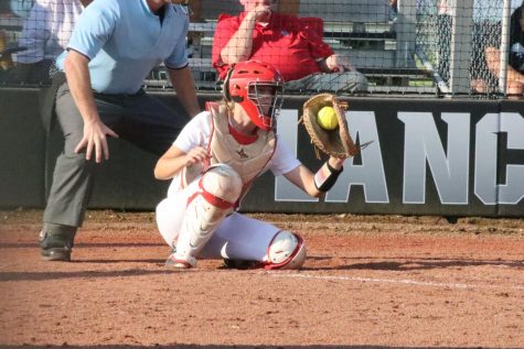 During the fourth inning of the game against Francis Howell on Sept. 1, sophomore catcher Lilian Ware grabs a pitch behind the plate. The Lancers won, 3-0  bringing their season record to 3-4.