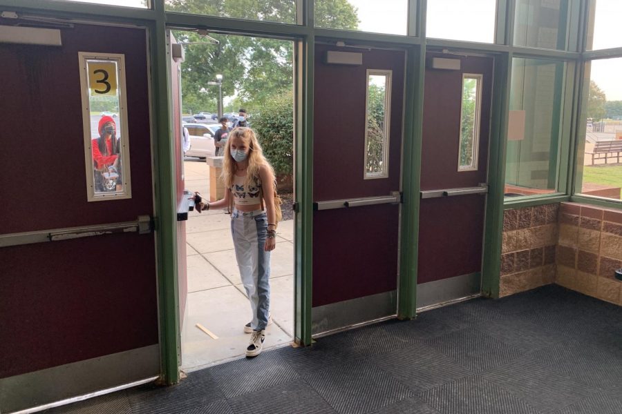 Sophomore Melissa Pinkstaff walks into school on Friday, Sept. 3, wearing a crop top as part of a staged protest.