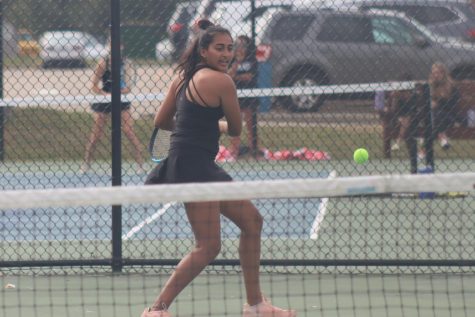 At Districts for girls tennis, senior Thrisha Kosaraju volleys back the ball to her opponents. Kosaraju and her opponent junior Saanvi Gudreddi won in their doubles match and are now headed to the State Tournament in Springfield, Missouri.