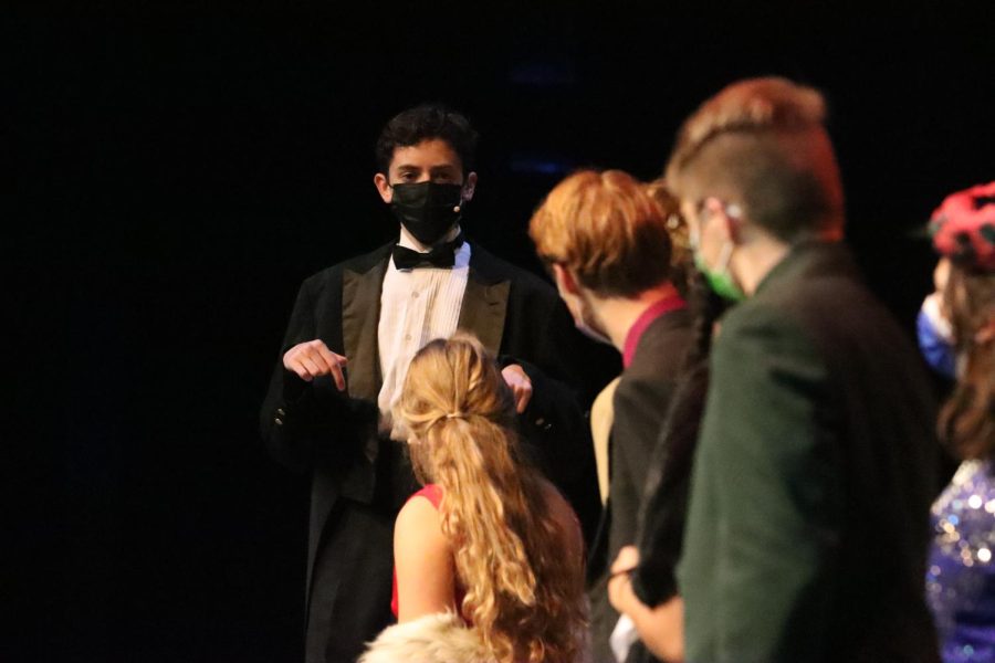 Wadsworth, the butler, played by junior Micah Bounds, explains to the rest of the characters how he believed the evenings events resulted in mutliple murders. His first accusation was that the character Mrs. Peacock had committed the murders.