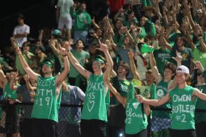 On the Sept. 24 senior night football game against Hazelwood West, students cheer in Lafayettes student section. The theme for the game was green-out in support of mental health awareness. Oct. 10 is World Mental Health Day.