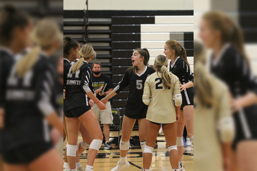 Senior Page Borgmeyer rallies her teammates during a game against St. Jospehs Academy on Sept. 28. Borgmeyer and the team won that game, as well as all their games since, culminating in eleven consecutive victories. 