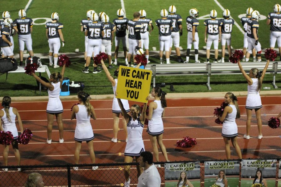 Cheerleaders use signs and cheers to support the team and rally the fans during the second half of the game. It was my first time every doing a cheer performance outside, it was a fun new experience compared to years in the past. I was so excited to perform since last year unfortunately we couldnt have the Homecoming assembly. Overall I was thrilled, everything was so much fun, senior Kamryn Sulzner, cheer captain, said.