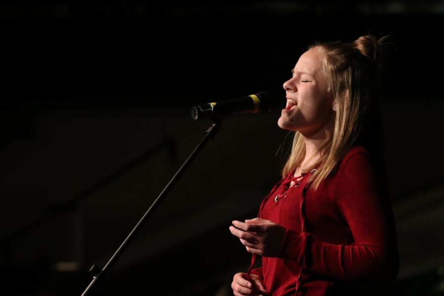 During Coffee House in 2018, senior Rachel Vishion performs. This year, Vishion will be performing for the first time as a vocalist for Tuesday Night Rock Band, which will open and close the show in addition to introducing each performance.