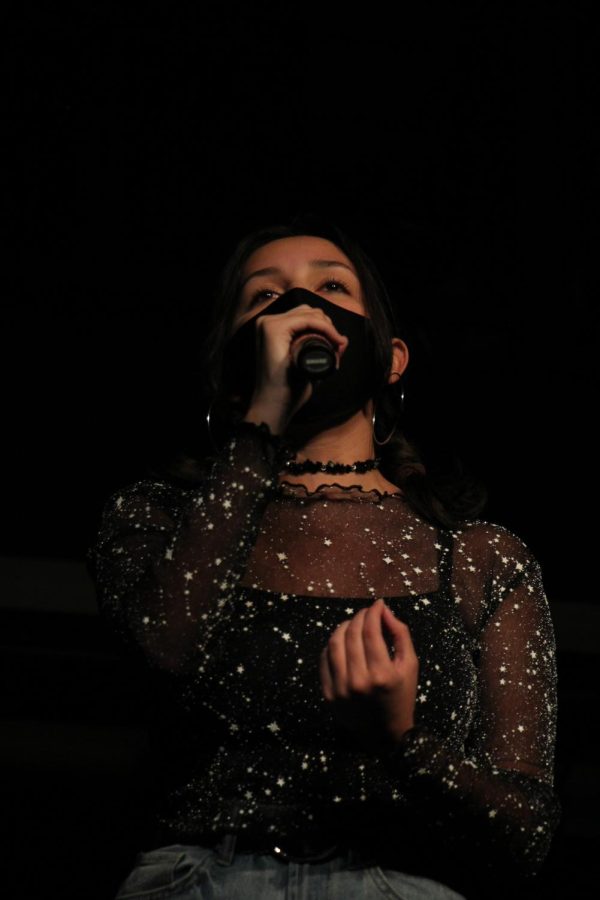 As the second performance of the night, sophomore Mera Flores sings Dream a Little Dream. Not only did Flores perform at Coffee House, she also is a member of the Lafayette Theatre Company (LTC) and played Mrs. Peacock in the latest LTC play, Classic Mystery Game.