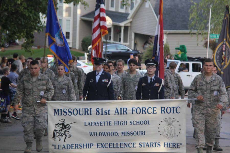 Members of the Air Force Junior Reserve Officers Training Corps (ROTC) program march in the Homecoming Parade on Oct. 1, 2021. After school, ROTC has been practicing to march in a Veterans Day parade that will occur at Pond Elementary School on Nov. 13. 