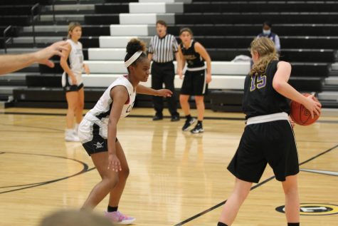 During the game against Francis Howell, junior Destiny Polk prepares to steal the ball from her opponent. As a defensive player, Polk has a total of 14 turnovers so far this season.