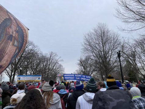 Protestors from St. Louis gather behind the Missouri Right to Life sign. The annual March for Life occurred on Jan. 21 with thousands of people in attendance.