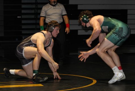 Senior Tommy Hagan faces off against a Lindbergh wrestler on Dec. 15. The Lancers continued their undefeated streak, winning against Lindbergh 68-6. This week, Hagan placed first in his weight class in the Red Schmitt Holiday Tournament in Granite City and the Lancers finished third overall.