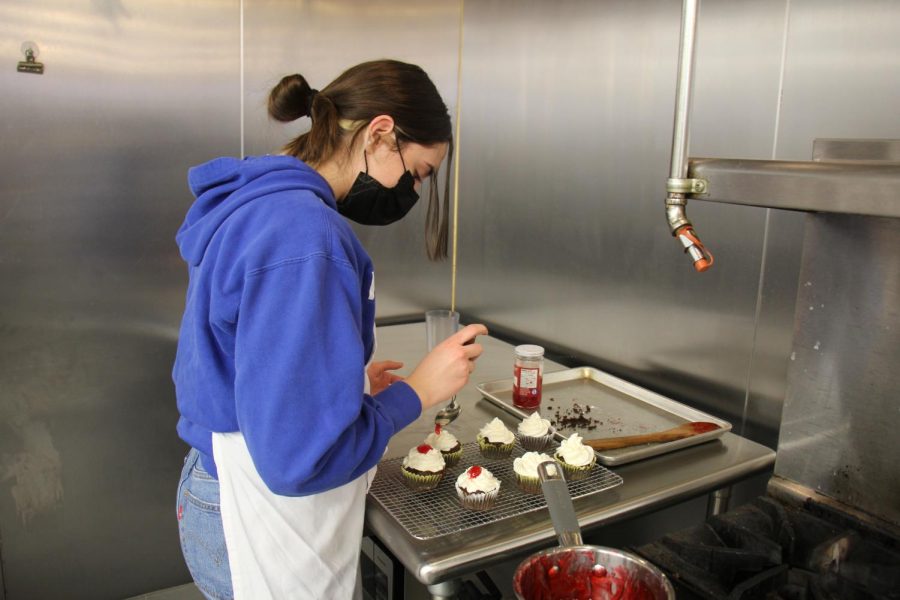 In December of 2021, junior Ella Stone decorates her cupcakes for a project in Culinary Arts 1. Hands-on classes similar to Baking and Pastry will do final assessments in the form of projects and assignments and vary from class to class.