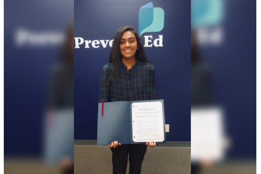 Senior Pooja Reddy holds a copy of Missouri Senate Bill No. 63 at the headquarters of PreventEd in St. Louis. The bill became effective on Aug. 28, 2021, and it established the Joint Oversight Task Force of Prescription Drug Monitoring in the state of Missouri.