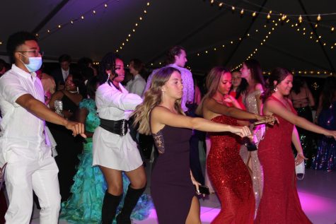 Class of 2021 students do The Whip at the 2021 Prom that took place in Lafayettes parking lot.  The 2022 Prom will also include juniors and will occur on April 30 at the Ritz-Carlton.