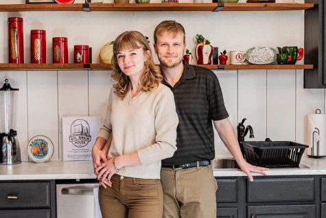 To promote their business, Airbnb owners Class of 2013 graduate Brian McKanna (right) and his wife Kat McKanna (left) pose for promotional photos. Taken on March 11, these photos featured the remodeled kitchen and other parts of the STL Brick House Airbnb.