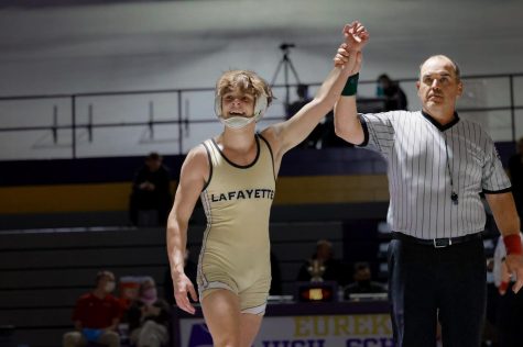 Senior Lane Tenny is declared the winner after a match in the Eureka Duals on Jan. 5. Lane only wrestled a limited amount of matches in the 2021-2022 season. 