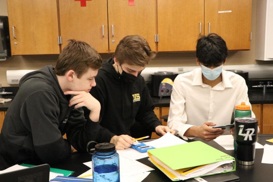 In Honors Chemistry, sophomores Lucas Brown, Neel Chandra and Jonathan Sair work on an assignment. The amount of COVID-19 cases in the Rockwood School District have been increasing every week since May 2, and just started decreasing on May 23.
