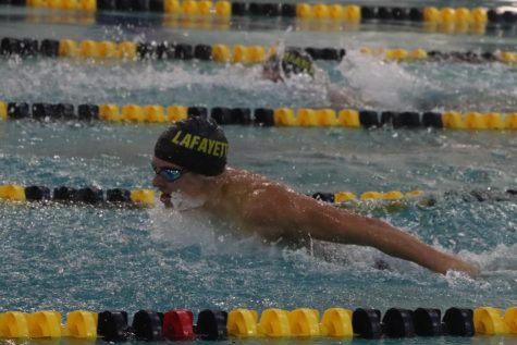 During a swim meet against Francis Howell Central, junior Caleb Warner performs the butterfly stroke. Warner placed 3rd in state last year for 100 meter breaststroke.