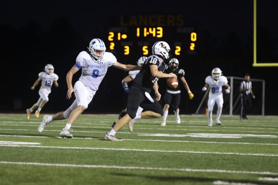In+Lafayettes+49-0+routing+of+Northwest+on+Sept.+16%2C+sophomore+QB+Jack+Behl+avoids+the+defense+as+he+fades+back+to+pass.+Behl+threw+for+two+touchdowns+in+the+game.+