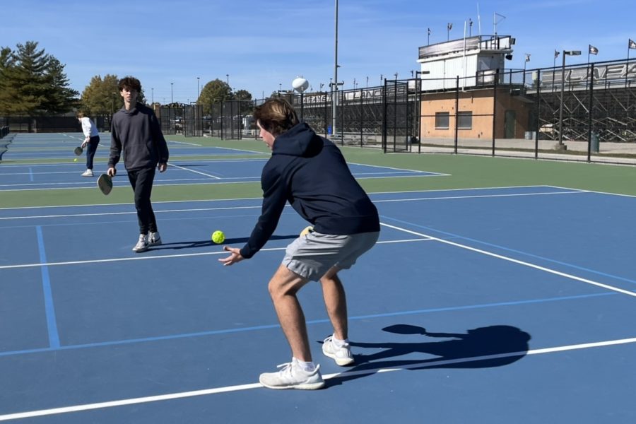 Going+for+the+shot%2C+junior+Austin+Reed+plays+in+the+AcLab+Lafayette+Pickleball+Society+club+with+junior+Danny+Salem-Pon.+Reed+began+playing+this+sport+before+the+club+was+founded+on+Oct.+5%2C+2022.+%E2%80%9C%5BWe+play%5D+once+every+couple+of+weeks%2C+we+go+over+to+the+courts+near+my+friend%E2%80%99s+house+on+a+good+weekend+when+the+weather+is+nice+and+we+just+hit+around%2C%E2%80%9D+Reed+said.