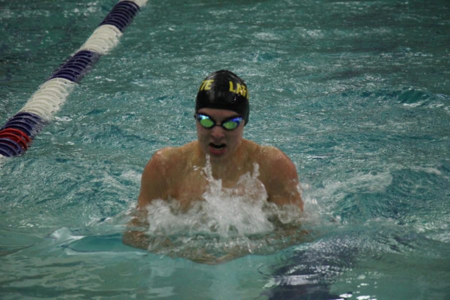 Warner swims his fastest time during 100-yard breaststroke event at the Conference Meet Oct. 26. He set a new LHS record with a time of 57.3 seconds.