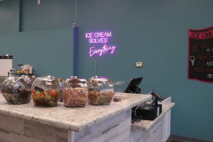 A sign above jars of candy inside of Silver Spoon Ice Cream and Sweets says Ice cream solves everything. The ice cream shop first opened in September and is located at 17225 New College Ave. in Wildwood. 