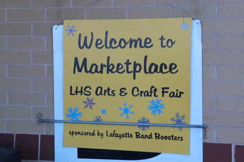 Lafayette marketplace sign hung in front of the welcome center on Dec. 3 to greet attendees entering the building.