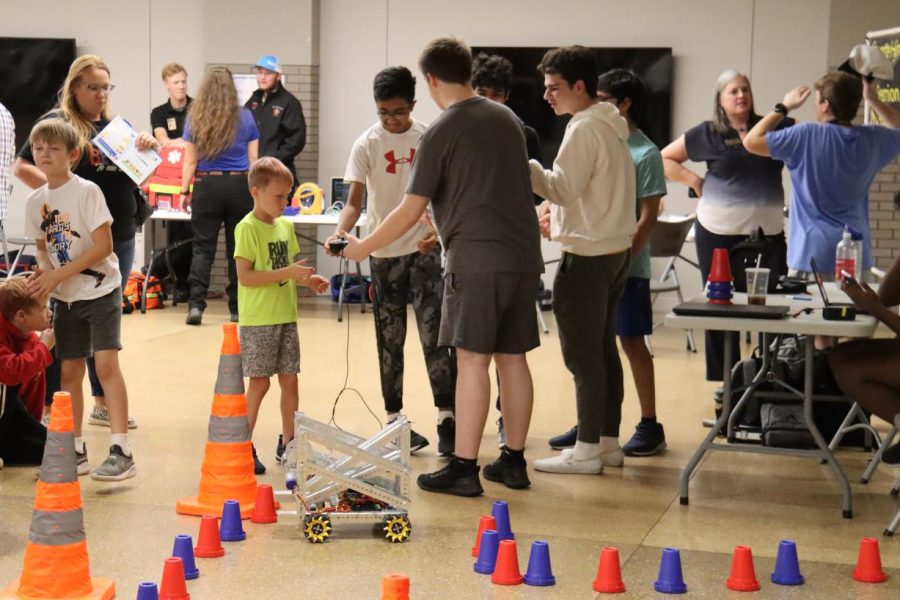 The Fermions team participates in a STEM night outreach event at Eureka Elementary School. During the STEM night, members taught the elementary school kids how their robot works and the kids learned how to drive it.