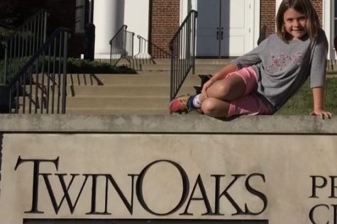 While in the 2nd Grade, sophomore Kyra Orrick sits on top of a sign outside of the Twin Oaks Christian School. Orrick said she got in trouble after the photo for wearing shorts against the schools dress code policy.