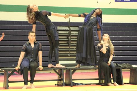 On Jan. 28, juniors Landon Griesbach and Elizabeth Tremper, sophomore Tose Toriolla and freshman Connor Kash perform part of their routine, Itll Be Okay. Winter Guard placed 1st in their division.