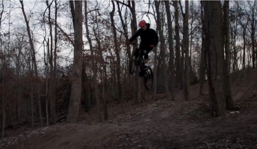 At one of his favorite spots to ride, junior Hunter Grander rides on a downhill trail at Bluff View Park. 