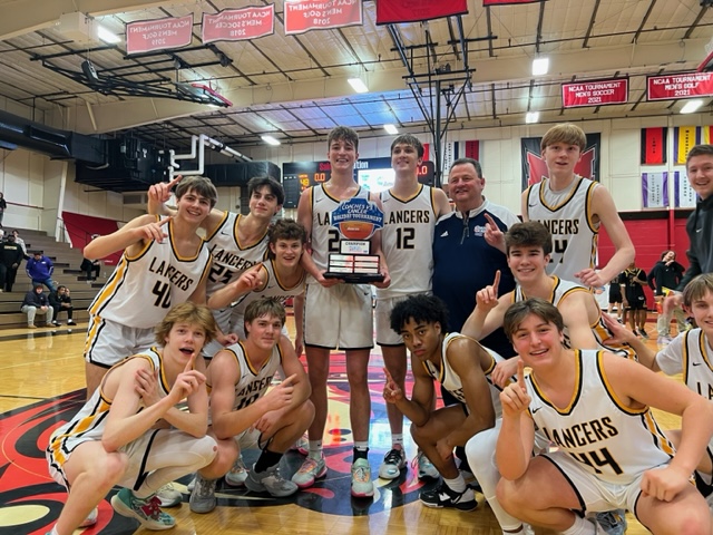 The+boys+basketball+team+won+the+Coaches+vs.+Cancer+Holiday+Tournament+at+Maryville+University.+They+were+the+13th+seed+going+into+the+tournament.+After+their+victory%2C+Head+Coach+Bryan+Keim+said%2C+I%E2%80%99m+extremely+proud+of+these+guys.+They+keep+believing+in+each+other+and+play+for+each+other.+They+are+so+much+fun+to+coach.