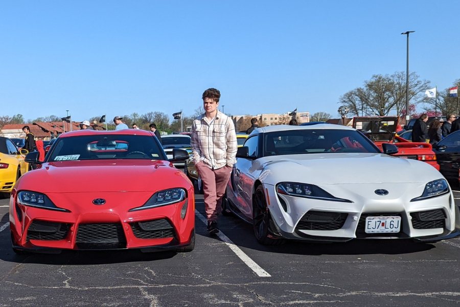 Junior Sam Buffa stands in between two Toyota Supras at a car meet. Buffa has had an interest in cars since he was a child, which was sparked by his fathers passion in cars.