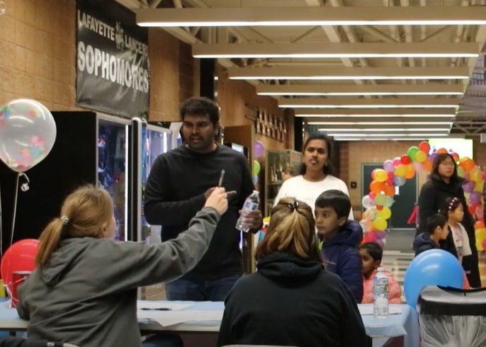 A large group of student and parent volunteers welcomed local families to the Winter Carnival on Jan. 21. The event was a fundraiser for the Class of 2026.