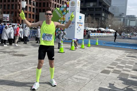 At the Tokyo marathon, math teacher Steven Stallis poses before recieving his medal. Stallis ran his personal record at the marathon, finishing 128 out of 27,927 racers.