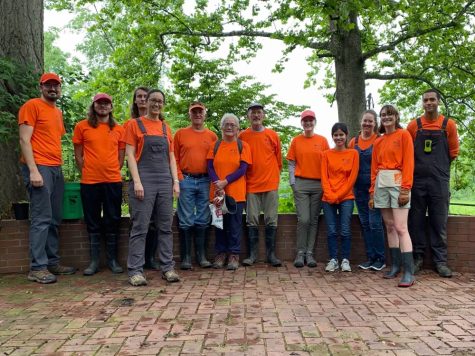 Right after a day of working, senior Tommy Ferguson and other volunteers and staff take a picture at the Litzsinger Ecology Center. Ferguson volunteers for the center when he has time. 