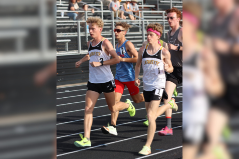 Neck and neck with each other, juniors Dillon Cronin and Jack Robeson race in the 3200-meter. Robeson placed 1st and Cronin placed 2nd in their district meet.