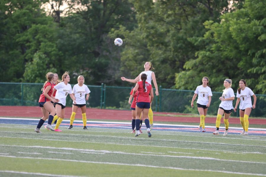 Leaping+from+the+ground%2C+junior+Hadley+Hendrickson+rises+for+a+header.+Hendrickson+scored+the+winning+goal+against+Liberty+with+a+rising+header+from+a+corner+kick.