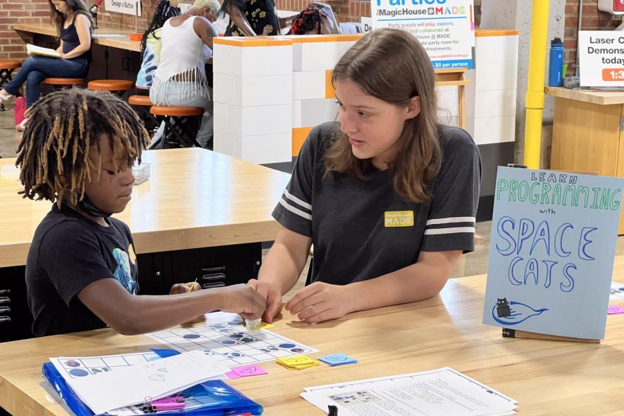 Junior Aly Palmquist teaches her STEM game Space Cats at the Magic House MADE for Kids located in St. Louis. Palmquist tested her game at four other locations.