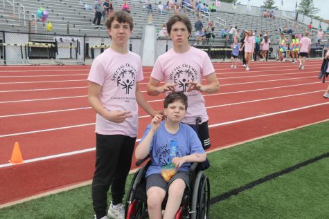 Brothers Paul and Jack Tobin went to the special Olympics as buddies to help their younger brother John Henry compete.