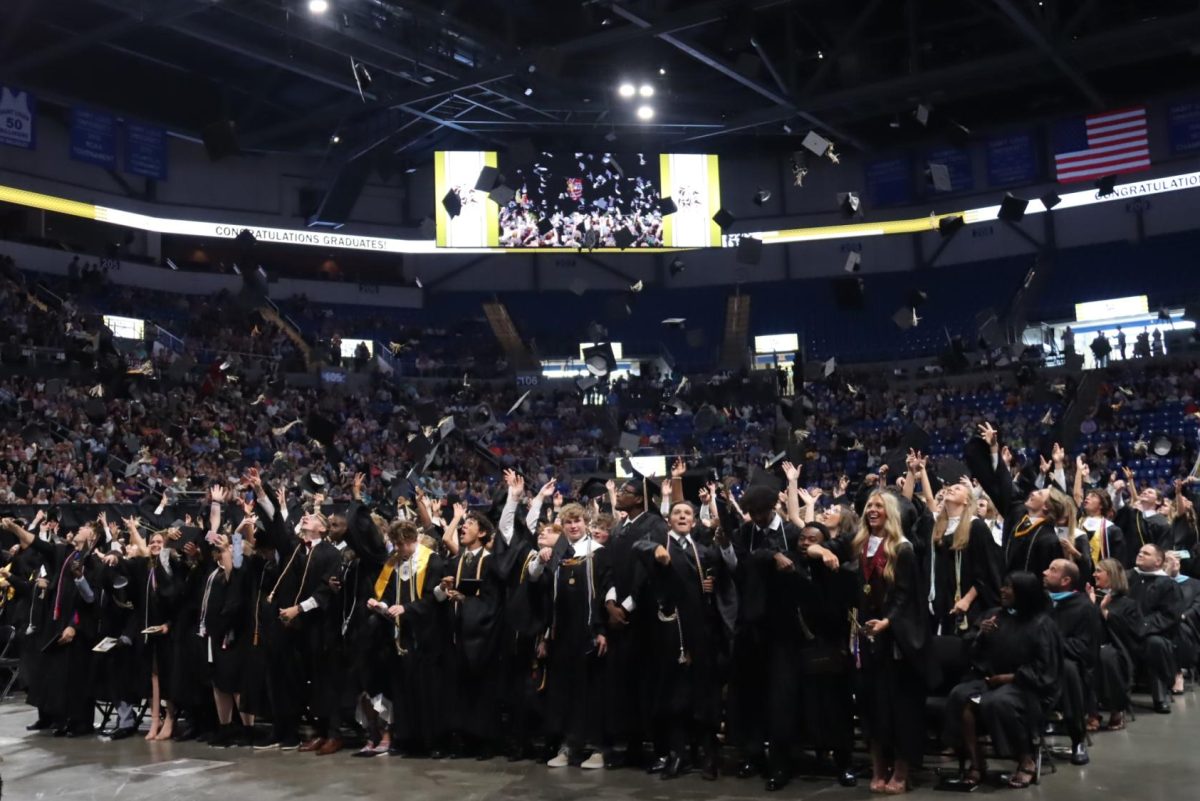 Class of 2023 graduates throw their graduation caps into the air at the Chaifetz Arena. While graduation was held there this past year, the Class of 2024 will graduate at The Family Arena, which is four minutes closer to Lafayette.
