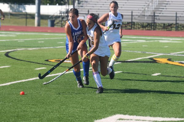 Locking arms with her Ladue defender, senior Olivia Williams competes for the ball. Williams is leading the St. Louis area in goals with eight. 