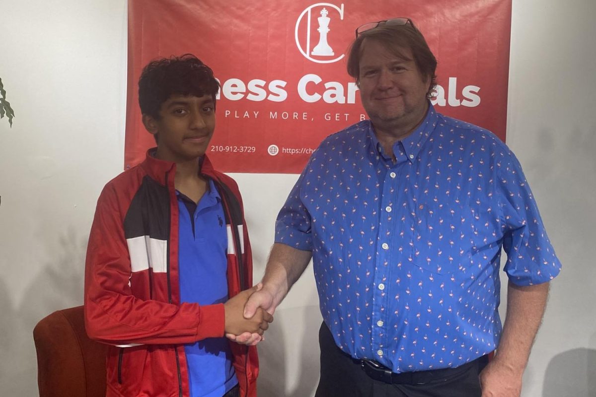 At the end of the 18th Annual Indianapolis Open, Abhinav Rao is congratulated by the tournament director. Rao tied for 2nd place with five other players, after he lost in the last round. I had fun at the tournament. It was tough but I played well, Rao said. 