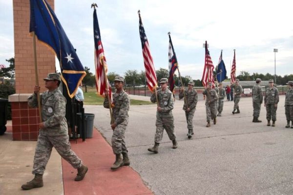 As the Patriot Day ceremony wraps up, AFJROTC walks back to Lafayette with flags. The ceremony took place before school to commemorate lives lost on the attacks of 9/11.
