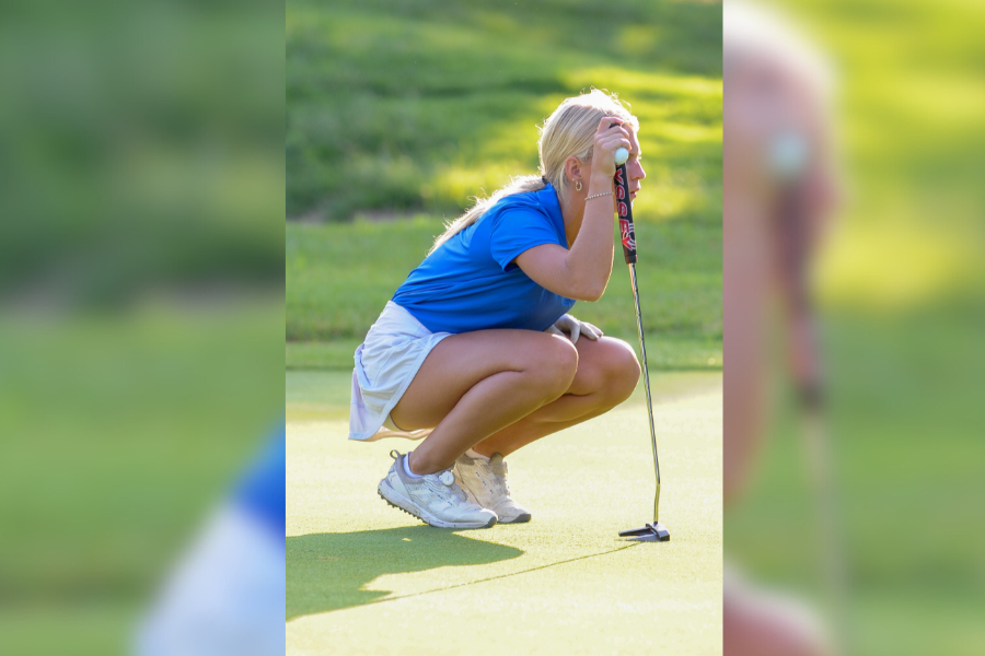 Hunched over her putter, junior Addy Surber reads the putt. Surber won Conference Player of the Year and qualified for State. While she was excited that she won Conference Player of the Year, she wasnt surprised, I was happy but I was undefeated for all my match, so I kind of expected it. 